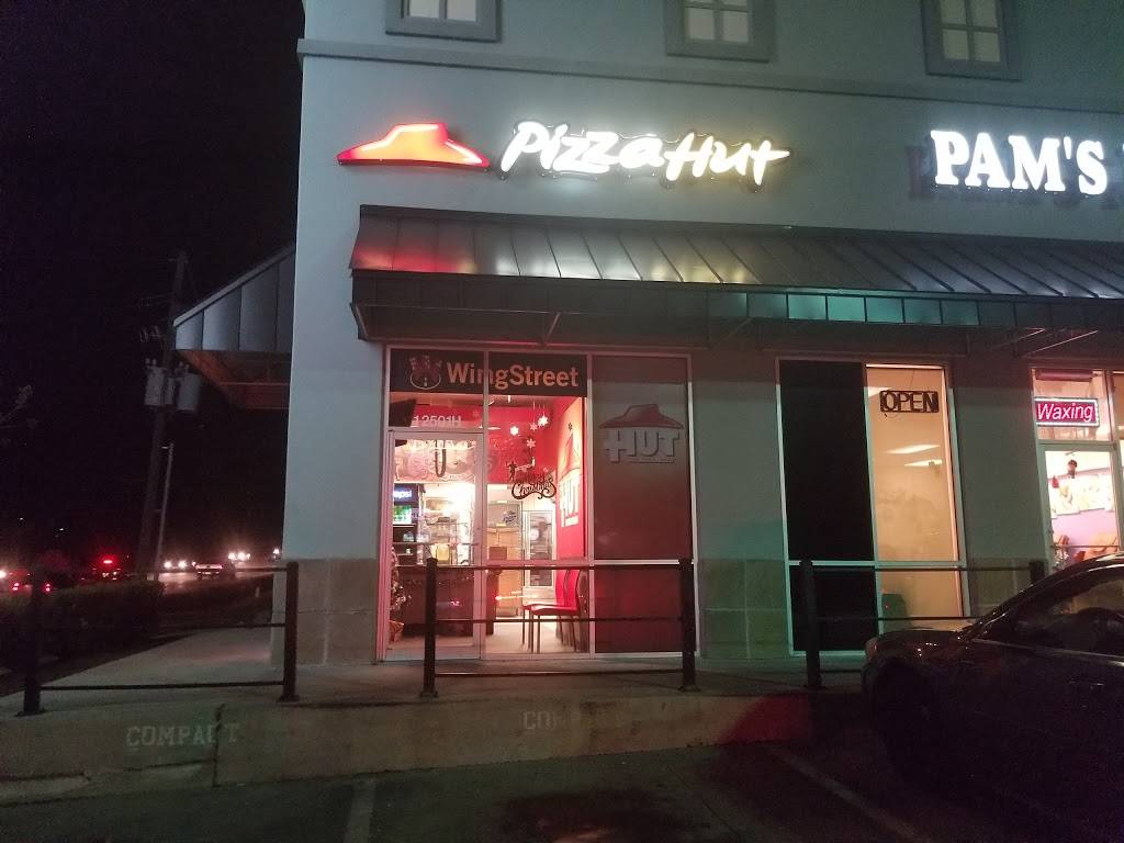 Pizza Hut | restaurant | 12501 Canyon Falls Boulevard Unit H, Willis, TX 77318, USA | 9368569596 OR +1 936-856-9596