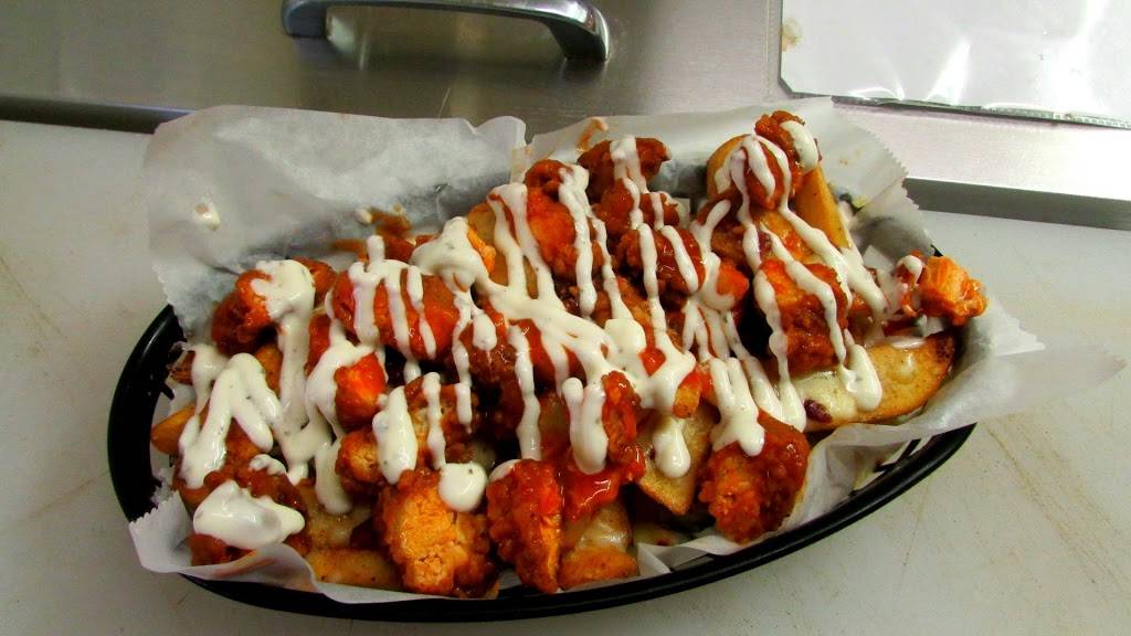 Between the Bun - Burgers, Dogs and More | restaurant | 2222 W Southport Rd STE A, Indianapolis, IN 46217, USA | 3173008327 OR +1 317-300-8327