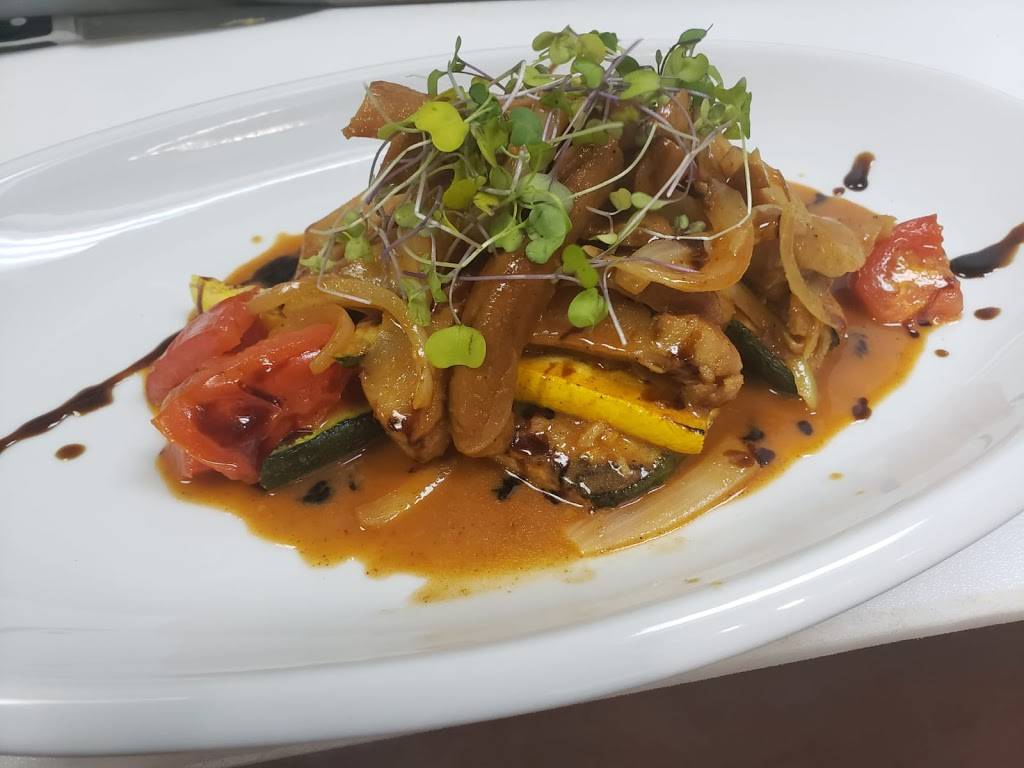 Justins Caribbean Fusion Restaurant | restaurant | 6700 Conroy Rd Ste 120, Orlando, FL 32835, USA | 4078660270 OR +1 407-866-0270