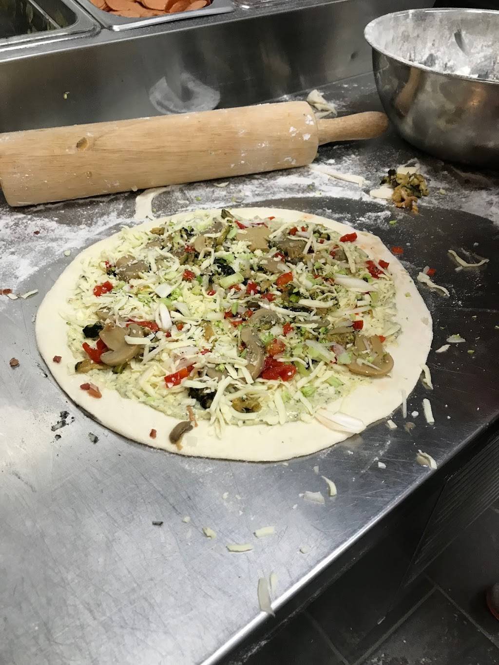 Juice and Roccos Pizzeria | restaurant | 52 Main St N, Brampton, ON L6V 1N6, Canada | 9054971999 OR +1 905-497-1999