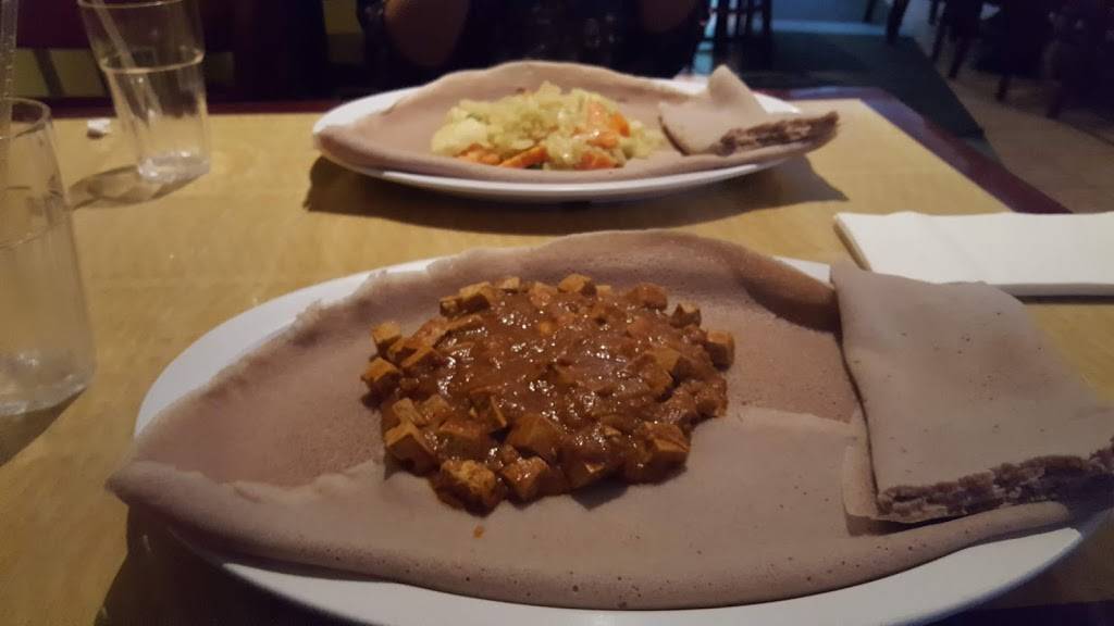 Kaffa Crossing Ethiopian Restaurant, Bar & Cafe | restaurant | 4421 Chestnut St, Philadelphia, PA 19104, USA | 2153860504 OR +1 215-386-0504